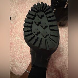 Black pair of Vince Camuto booties.  Has never been worn